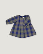A long-sleeve children's dress with a blue, beige, and white plaid pattern, laid flat on a light gray background.