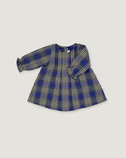 A long-sleeve children's dress with a blue, beige, and white plaid pattern, laid flat on a light gray background.