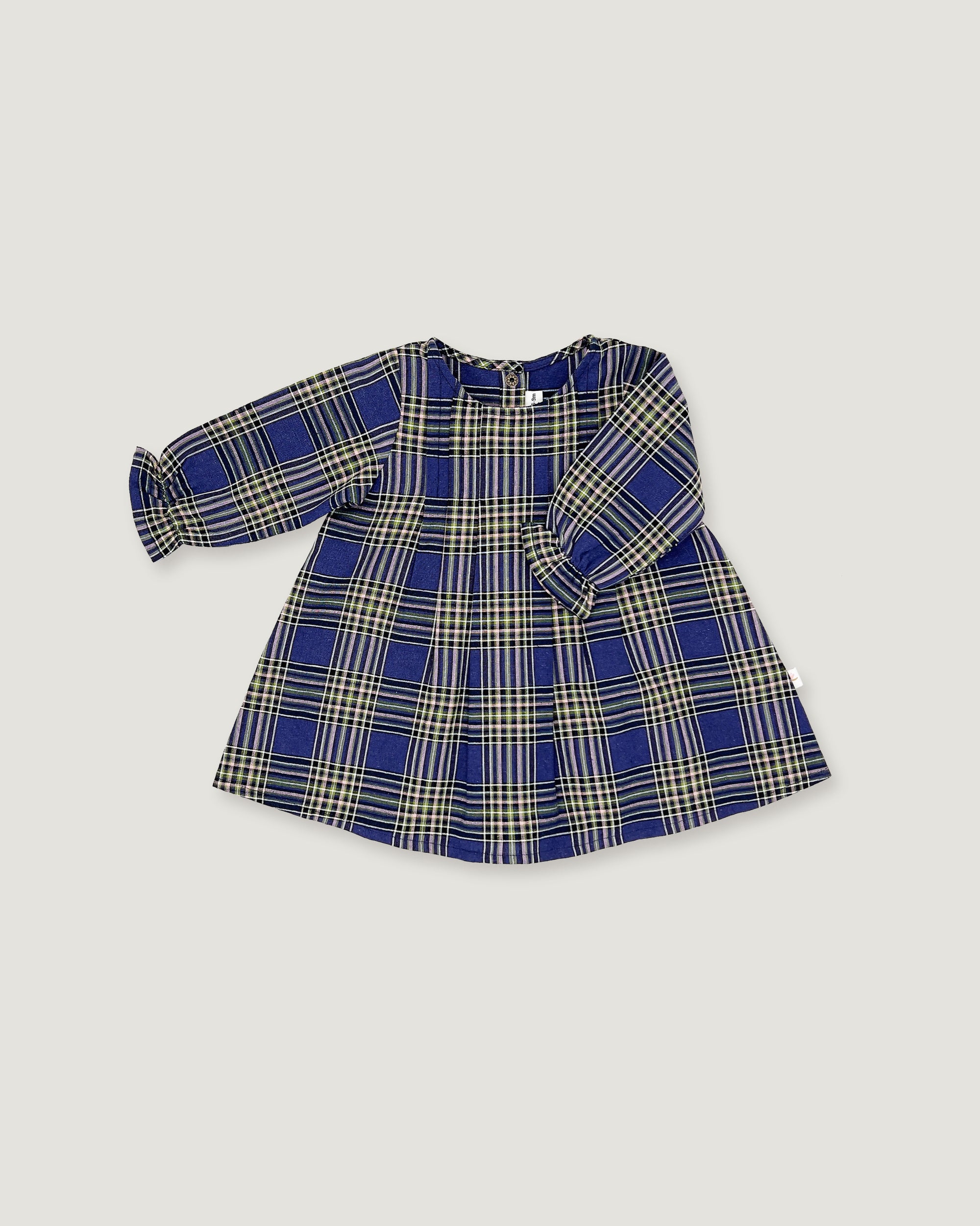 A long-sleeve children's dress with a blue, beige, and white plaid pattern, laid flat on a light gray background.