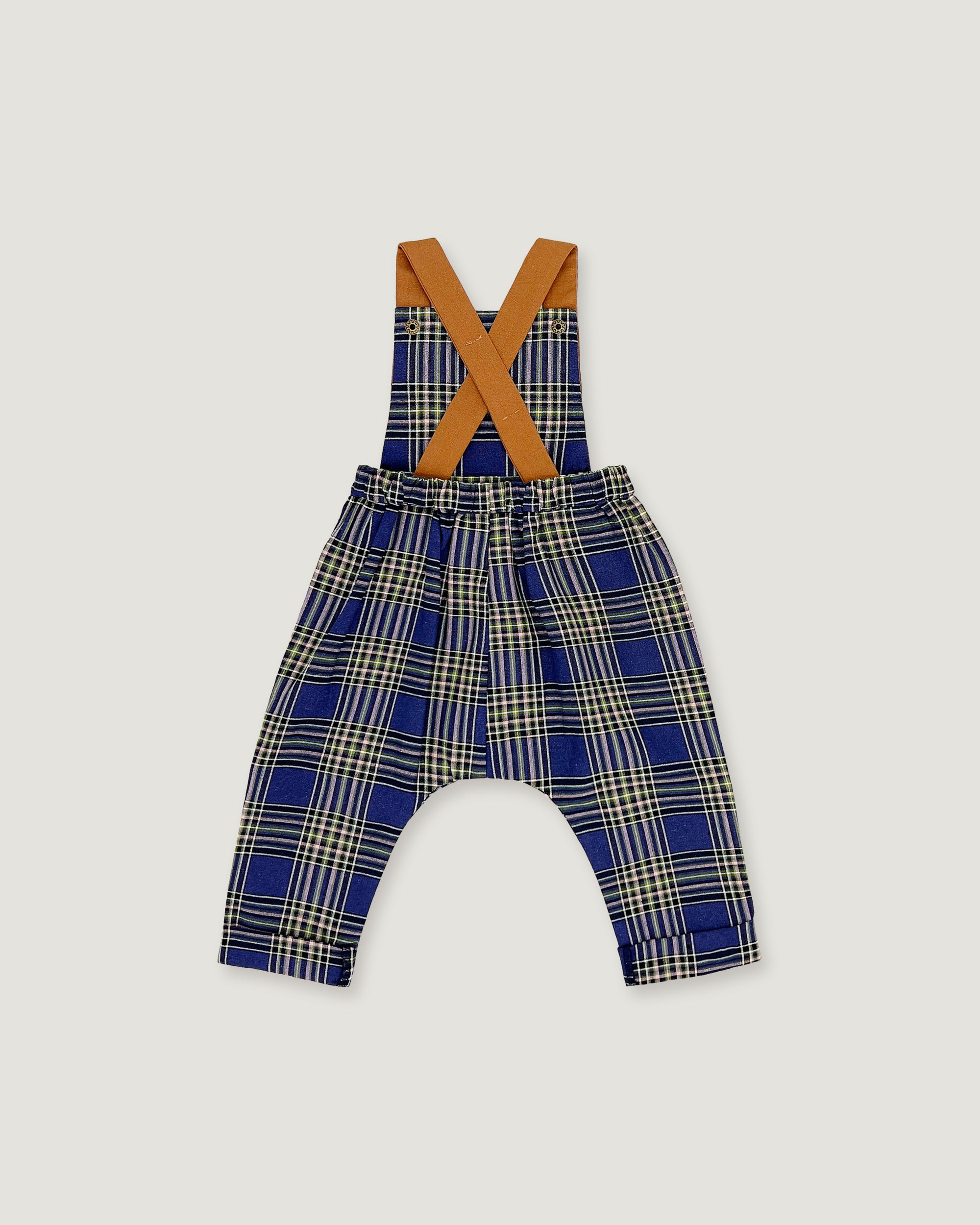 A baby romper with suspenders featuring a blue, beige, and white plaid pattern, with contrasting tan shoulder straps, shown on a light gray background.