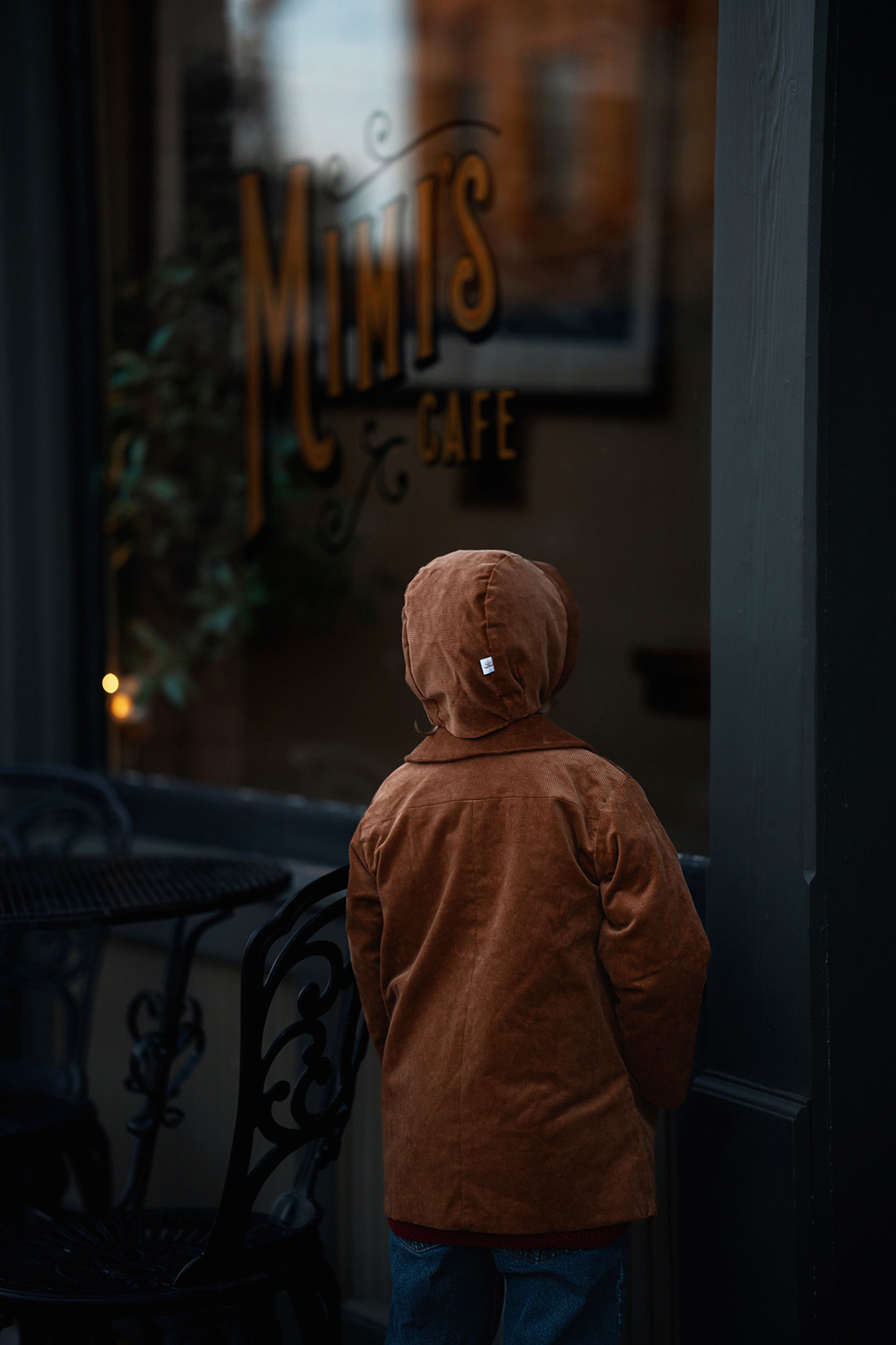 Back View with Bonnet: Back view of little boy in the Camel coat and bonnet, emphasizing the coat’s durability and timeless appeal for eco-conscious families.