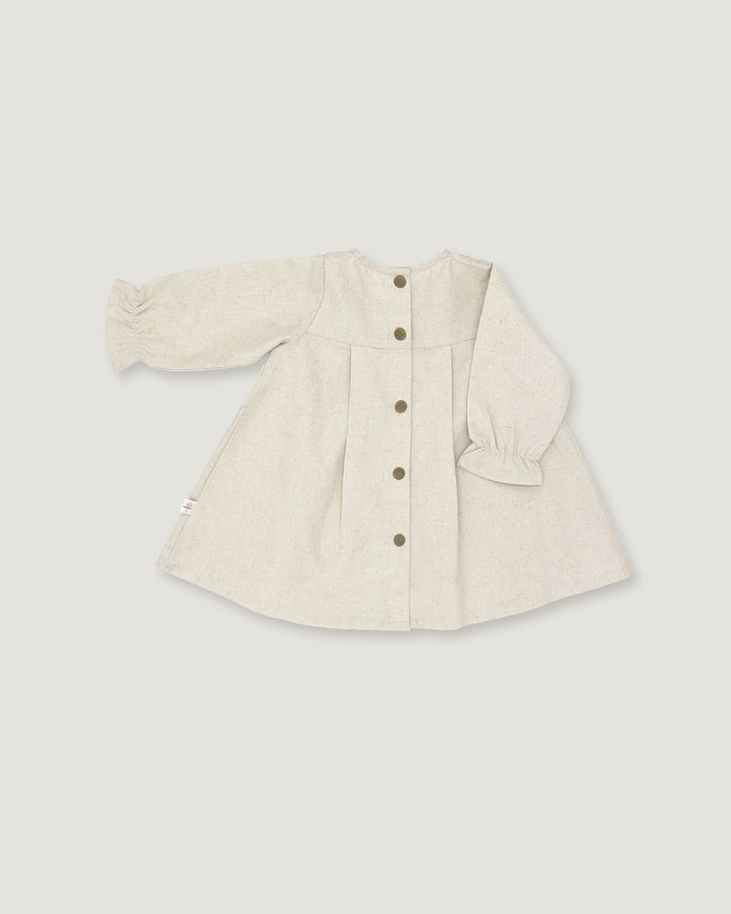 A light beige linen long-sleeve cardigan with a button-up front, pleated details, and ruffled cuffs, shown flat on a neutral light gray background.