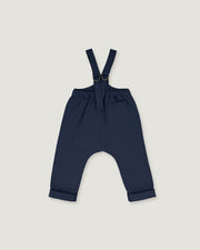 A pair of navy blue baby pants with adjustable suspenders, displayed flat against a light gray background.