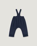 A pair of baby boy's navy blue suspenders with a unique curved leg design and cuffed hems, shown flat on a light gray background.