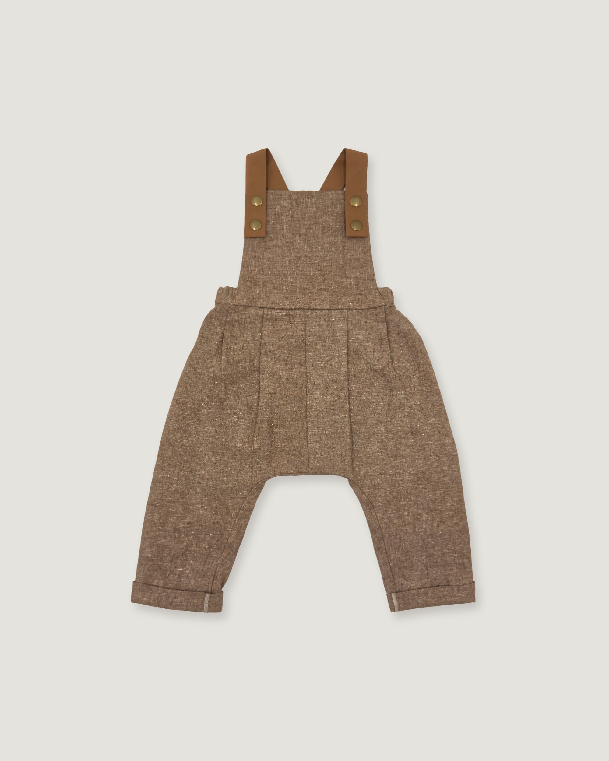 A pair of toddler boy's brown tweed overall-style pants with adjustable shoulder straps and brass-tone snap buttons, shown flat on a light gray background.