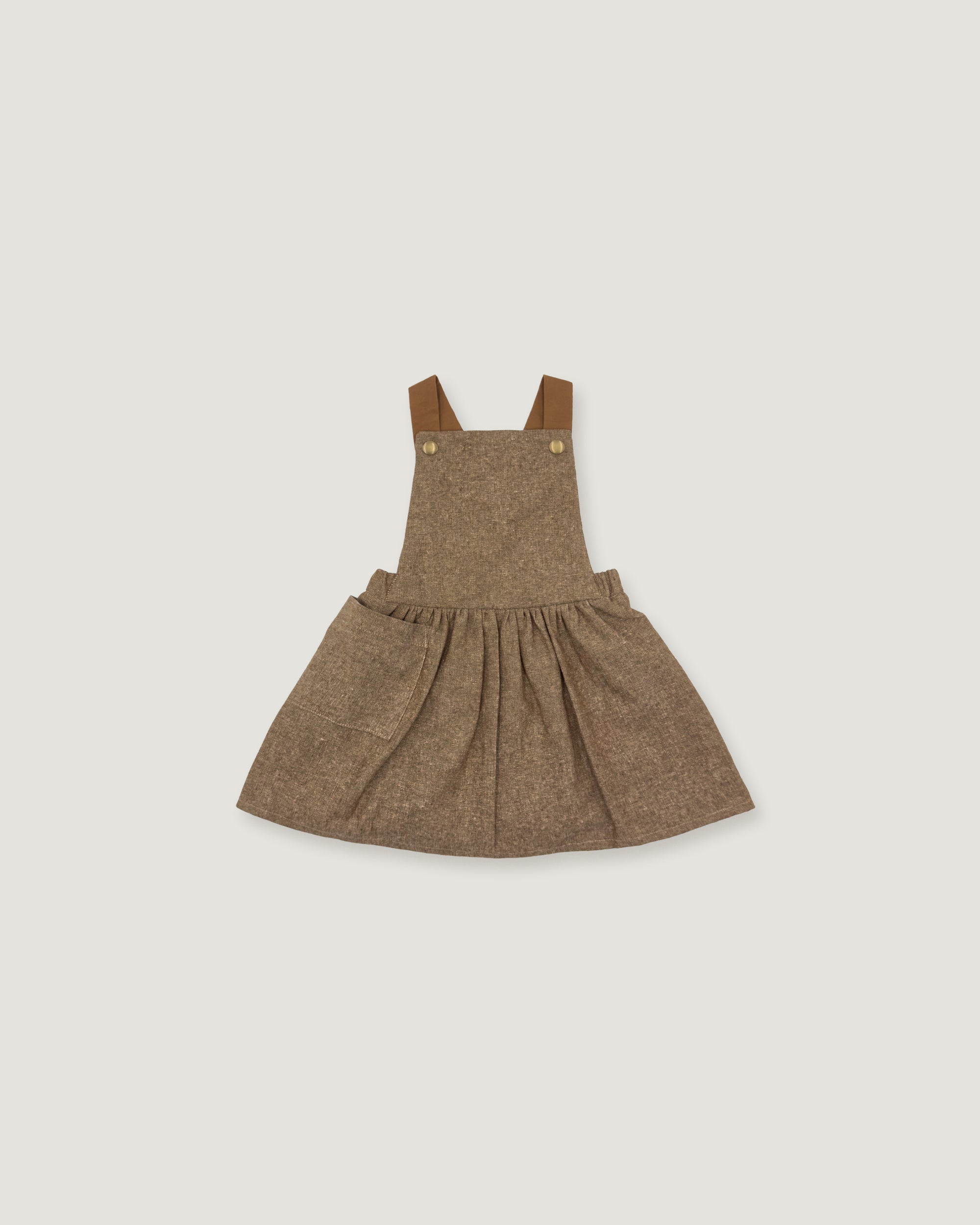 A toddler girl's brown tweed overall dress with adjustable shoulder straps and a gathered skirt, shown flat on a light gray background.