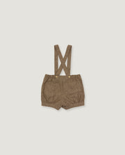 A pair of toddler's brown suspender shorts with a textured woven fabric, laid flat on a light gray background.
