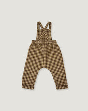 A baby romper with suspenders in a brown and beige gingham check pattern, laid flat on a light gray background.