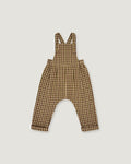 A baby romper with brown and beige gingham check print, featuring shoulder straps and a wide leg design, shown flat on a light gray background.