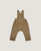 A baby romper with brown and beige gingham check print, featuring shoulder straps and a wide leg design, shown flat on a light gray background.