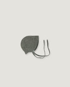 A green gray fabric bonnet with long ties, photographed flat against a solid light gray background.