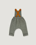 A pair of baby boy's heather gray linen suspenders with contrasting orange-brown leather straps, shown flat on a light gray background.