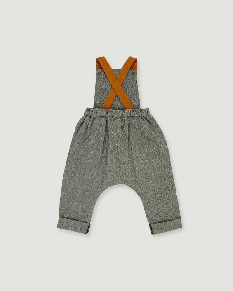 A pair of baby boy's heather gray linen suspenders with contrasting orange-brown leather straps, shown flat on a light gray background.