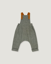 A pair of baby overall pants in heather gray wool, featuring brown leather shoulder straps with snap buttons, shown flat on a light gray background.