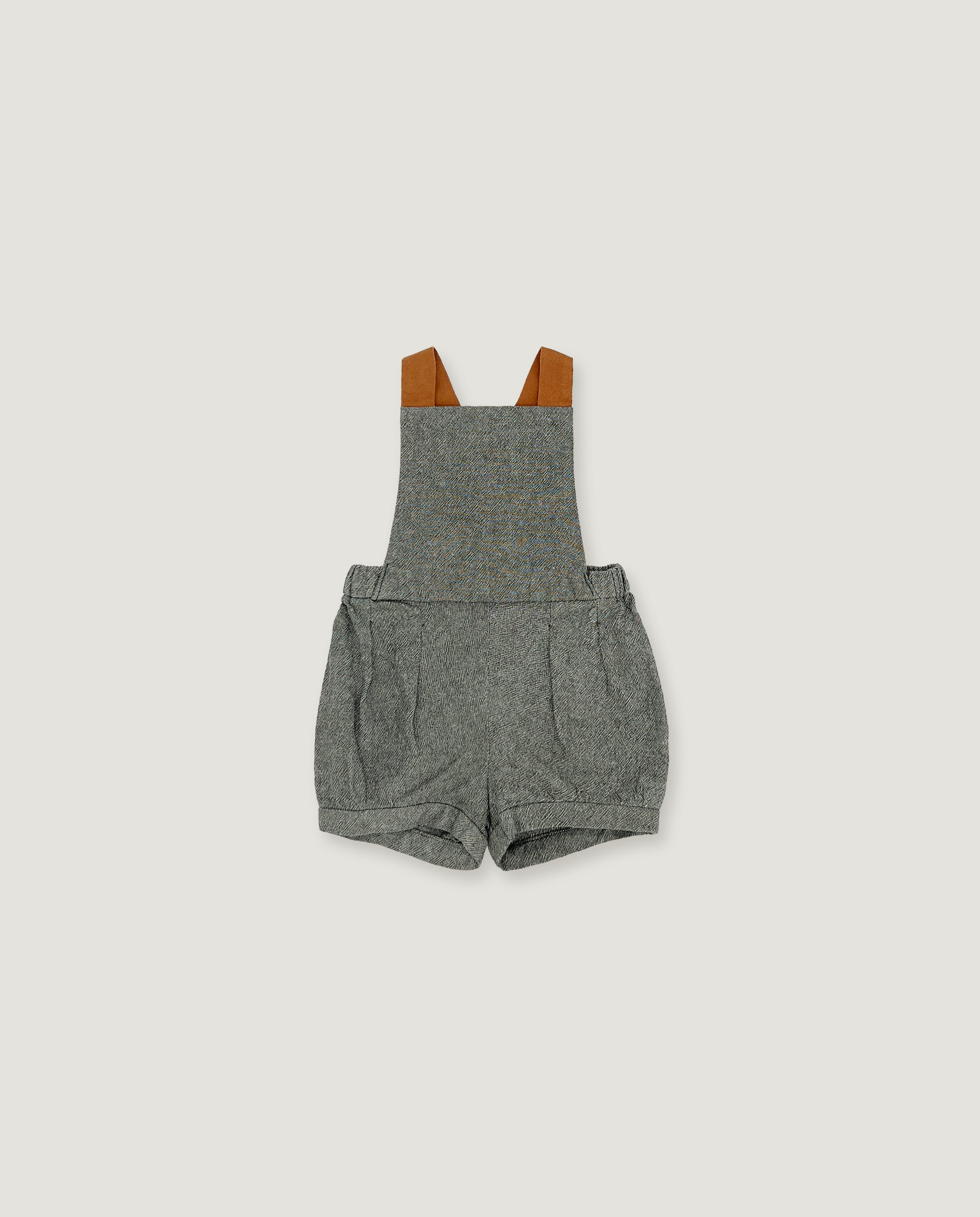 A pair of baby boy's heather gray overall romper shorts with brown shoulder straps, shown flat on a light gray background.