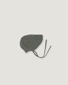 A green linen bonnet with a long visor  on a white background