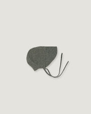 A green linen bonnet with a long visor  on a white background