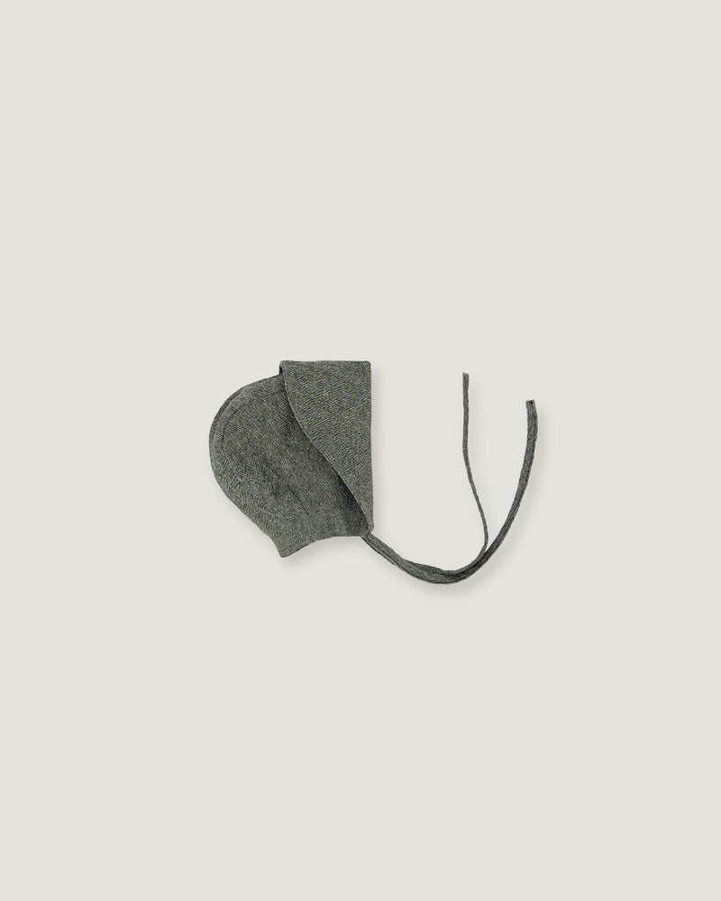 A green linen bonnet with a long visor rolled up  on a white background