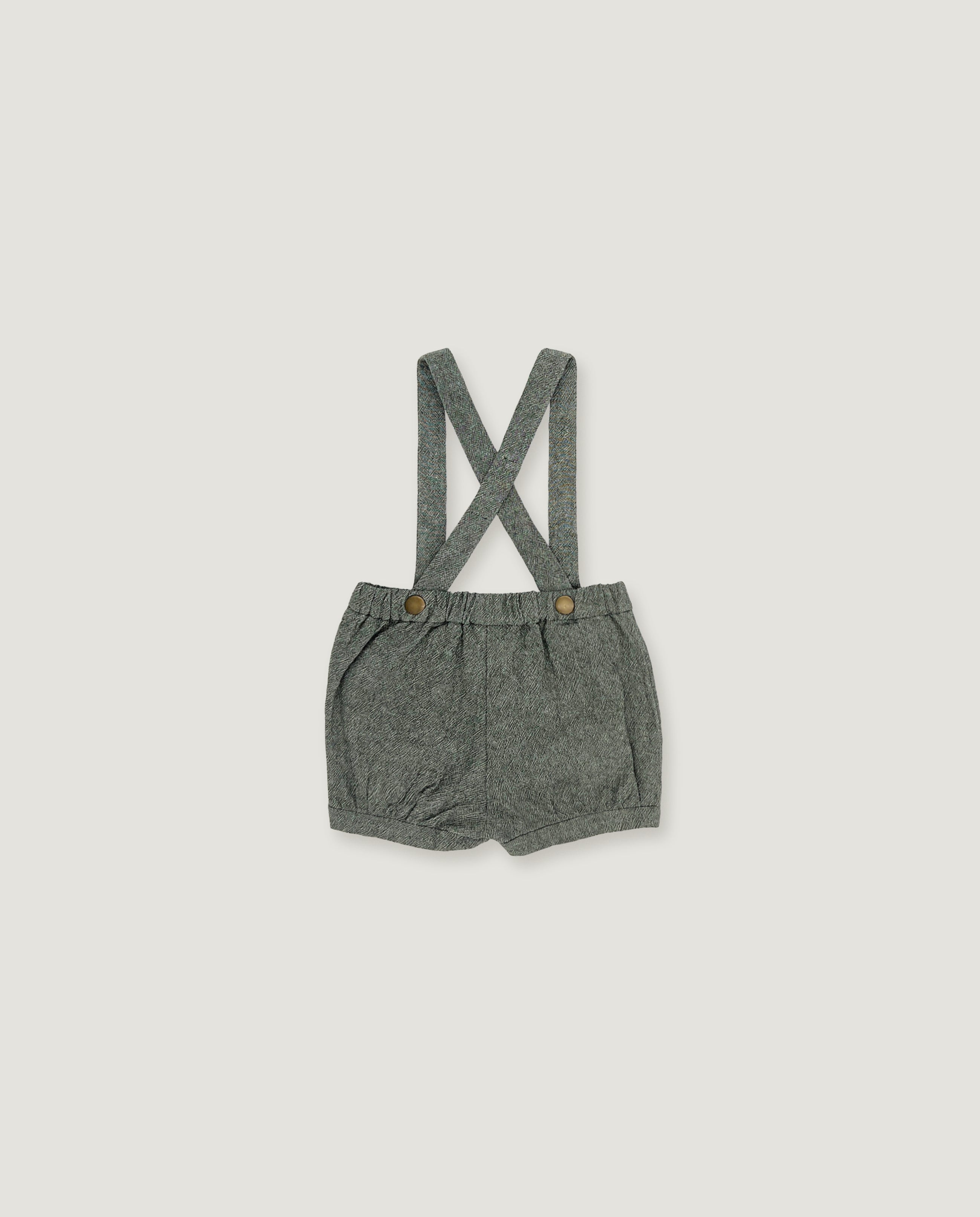 A pair of baby boy's heather gray linen suspender shorts with adjustable straps and small decorative buttons, shown flat on a light gray background.