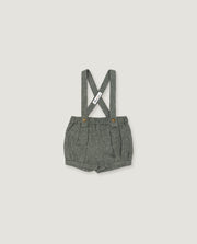 A pair of toddler's gray woven linen suspender shorts with a pleated front and adjustable shoulder straps, shown flat on a light gray background.
