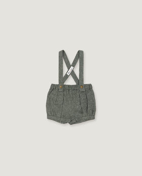 A pair of toddler's gray woven linen suspender shorts with a pleated front and adjustable shoulder straps, shown flat on a light gray background.