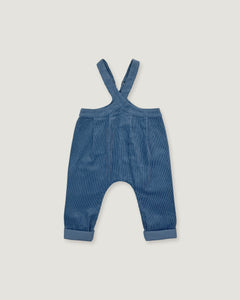 A pair of baby corduroy overalls in a dusty blue color, featuring adjustable shoulder straps and cuffed legs, shown flat on a light gray background.