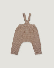 A pair of toddler's harem-style suspenders in a brown and beige gingham pattern, laid flat against a light gray background.