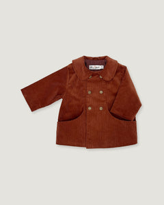A toddler's brown corduroy jacket with a wide collar, double-breasted buttons, and front patch pockets, shown on a light gray background.