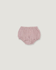 A pair of baby bloomers in a pink and white gingham pattern, photographed flat against a solid light gray background.