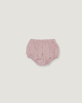 A pair of baby bloomers in a pink and white gingham pattern, photographed flat against a solid light gray background.