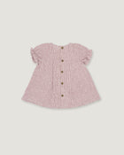 A pink and white gingham baby top with short ruffled sleeves and a button-up front, shown flat on a light gray background.