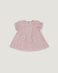 A pink and white micro-check patterned baby dress with short puff sleeves, shown flat on a light gray background.