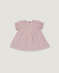 A pink and white micro-check patterned baby dress with short puff sleeves, shown flat on a light gray background.