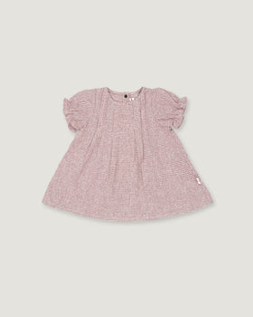 A pink and white micro-check patterned baby dress with short puff sleeves, shown flat on a light gray background.