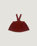 A dark reddish-brown corduroy baby dress with shoulder straps, laid flat against a light gray background.