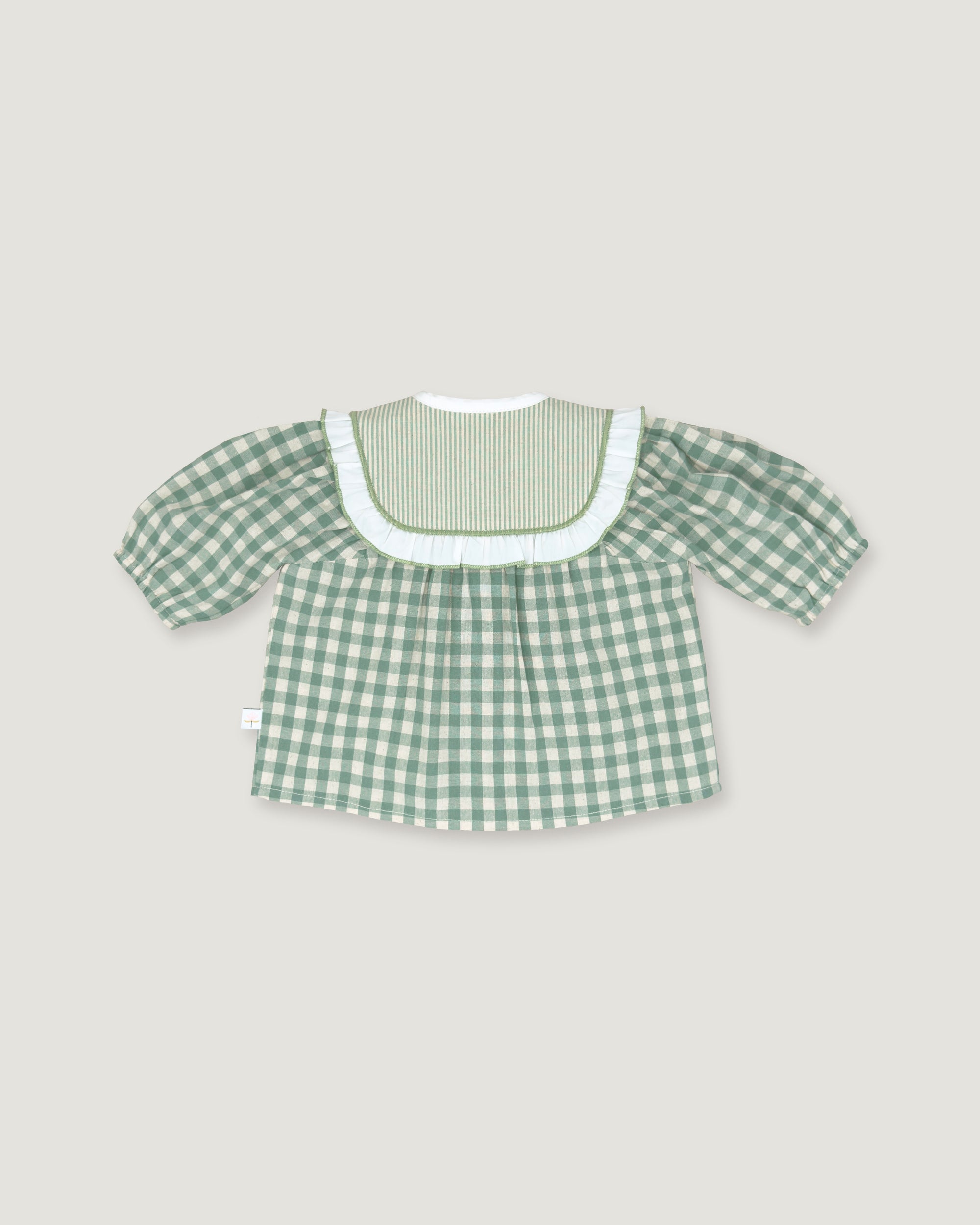 A green and white gingham short-sleeve top with a ruffled white collar, displayed flat against a light gray background.
