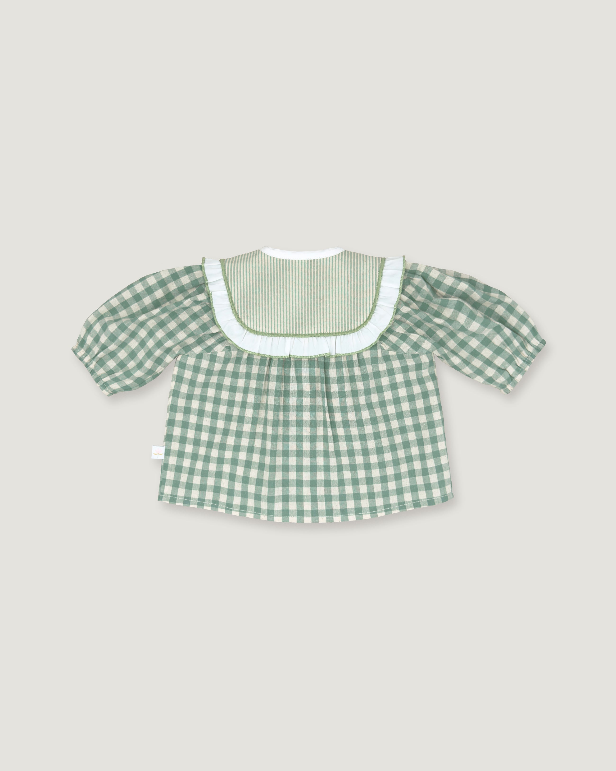 A green and white gingham short-sleeve top with a ruffled white collar, displayed flat against a light gray background.