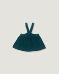 A dark teal corduroy baby dress with shoulder straps, laid flat on a light gray background.