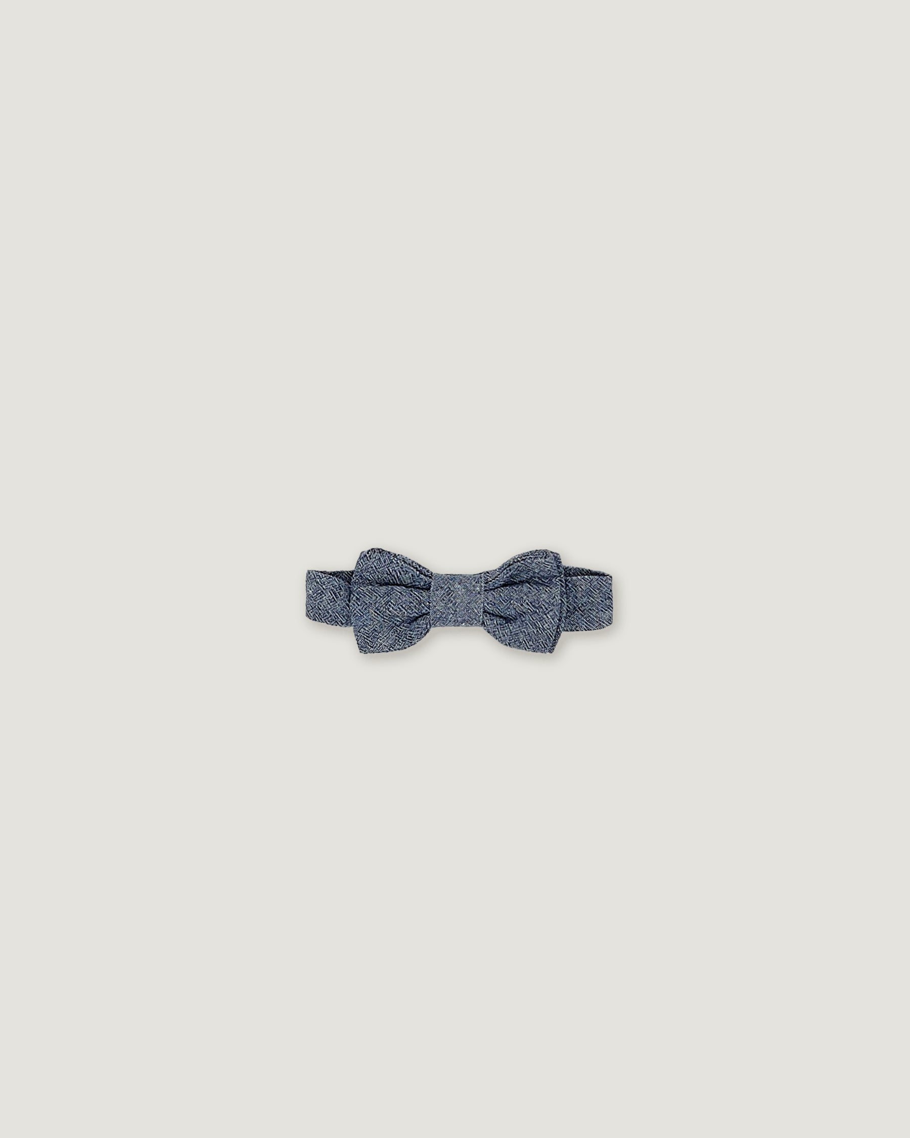 Bow tie in a denim blue linen for boys on a white background