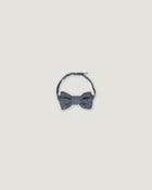 Bow tie for boys in a denim blue over a white background