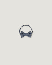 Bow tie for boys in a denim blue over a white background