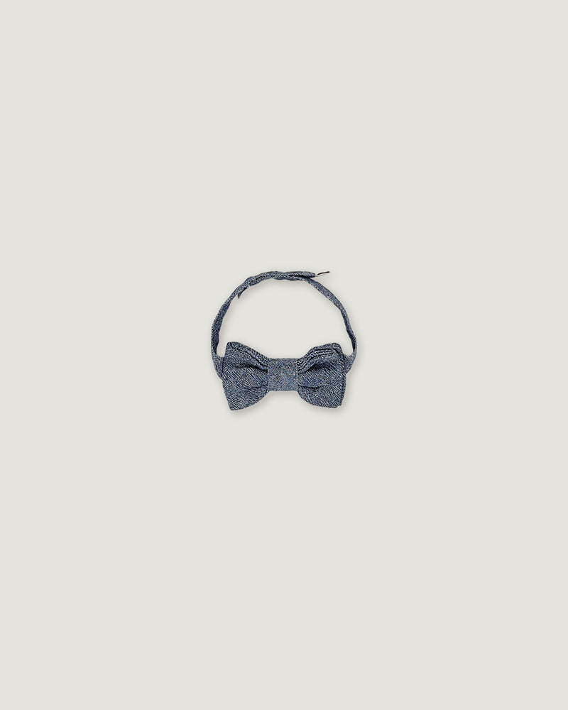 Bow tie for boys in a denim blue over a white background
