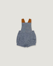 A baby romper in heathered blue-gray fabric with brown shoulder straps, shown flat against a light beige background.