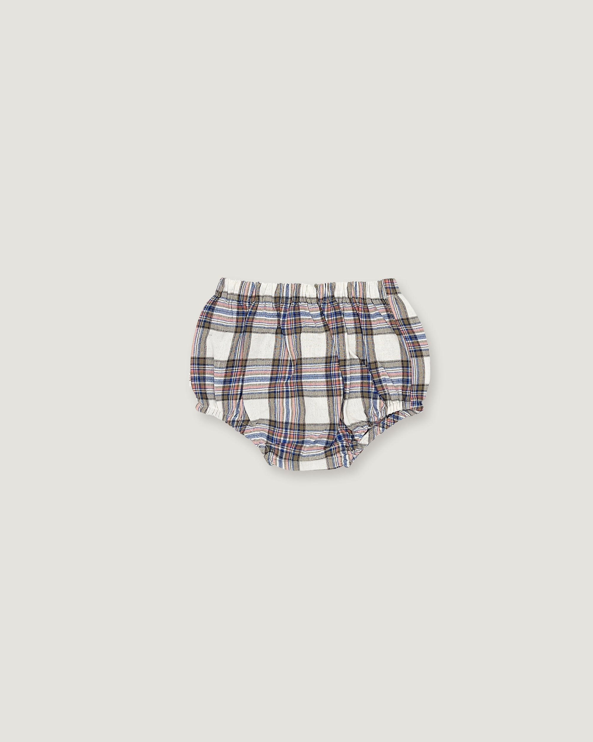 A pair of baby bloomers with a white base and a blue, red, and black plaid pattern, shown flat against a light gray background.