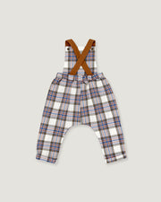 Toddler boy's plaid suspenders with brown crossed shoulder straps, featuring a white base with blue, red, and brown plaid lines, shown flat on a light gray background.