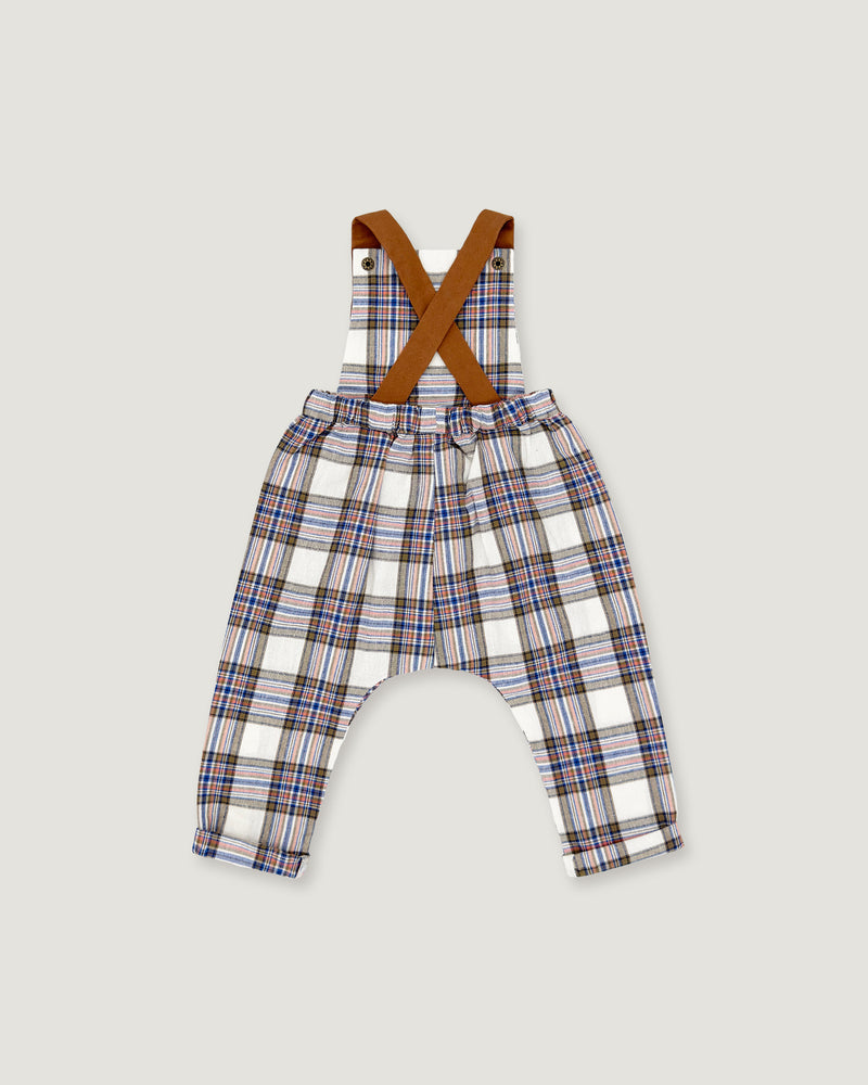 Toddler boy's plaid suspenders with brown crossed shoulder straps, featuring a white base with blue, red, and brown plaid lines, shown flat on a light gray background.
