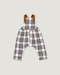 A pair of baby overalls featuring a white, blue, and red plaid pattern, with brown adjustable shoulder straps, shown flat on a light gray background.